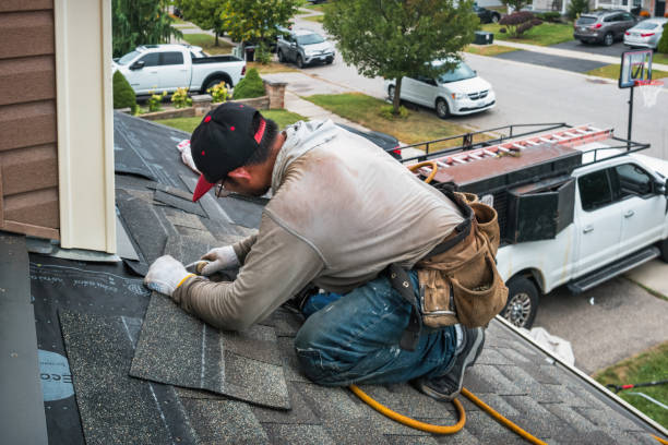 Professional Roofing technician working in Crownsville, MD